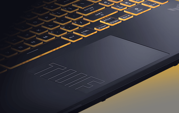 A close-up view of the TUF Gaming F16’s lower keyboard and trackpad, with the TUF logo clearly visible on the trackpad.