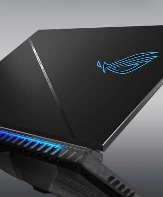 The laptop lid is shown, with the slash design reflecting the surrounding light.